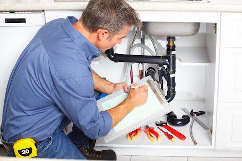 guy working on plumbing